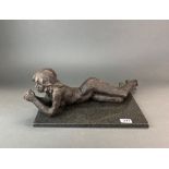 A sculptor's pottery maquette of a girl, resting on a marble base, sculpture L. 56cm.
