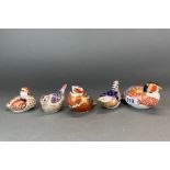 A group of five Royal Crown Derby bird paperweights, largest 18cm.