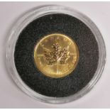 A Canadian maple leaf gold 1995 one dollar coin.