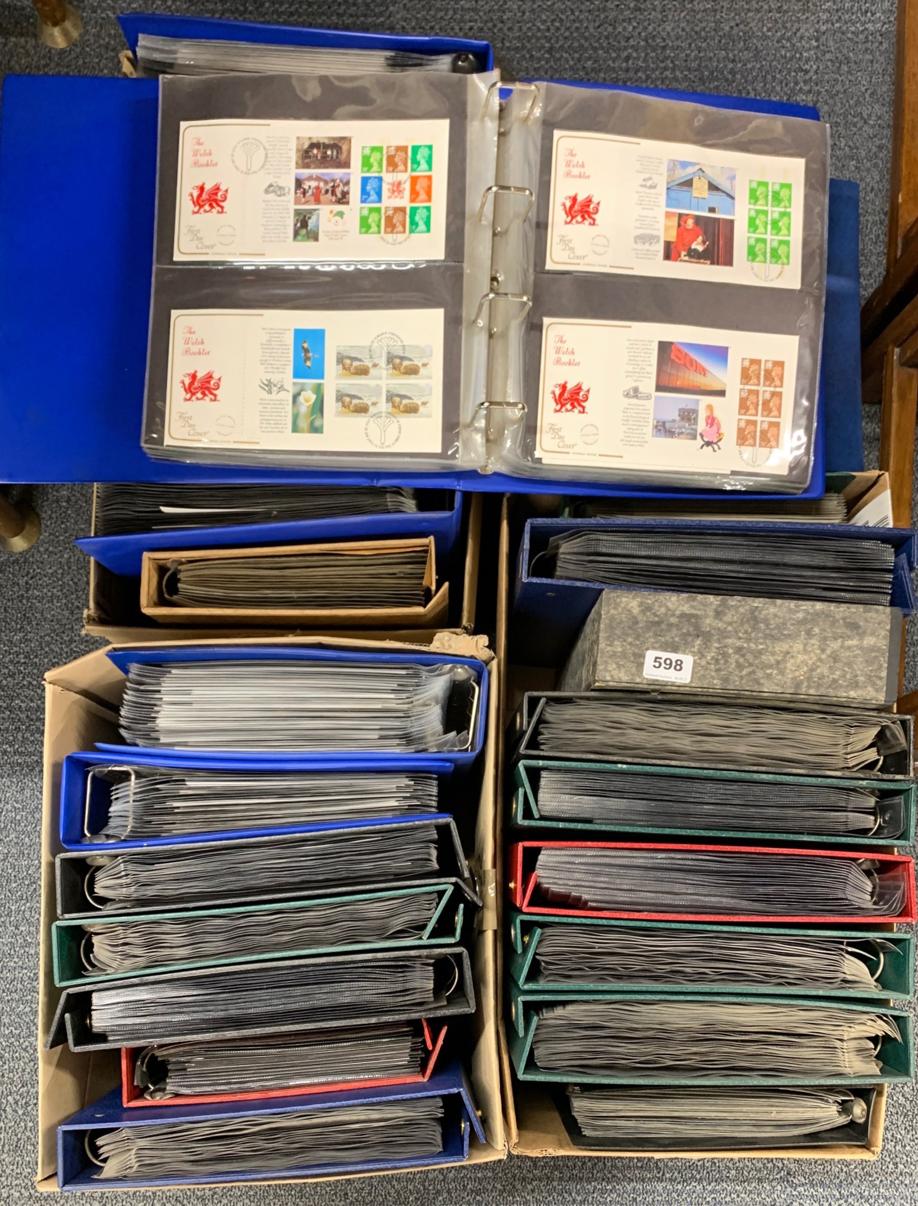 A large quantity of first day cover stamp albums.