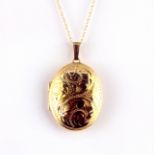 A 9ct yellow gold locket and chain, L. 3.8cm.