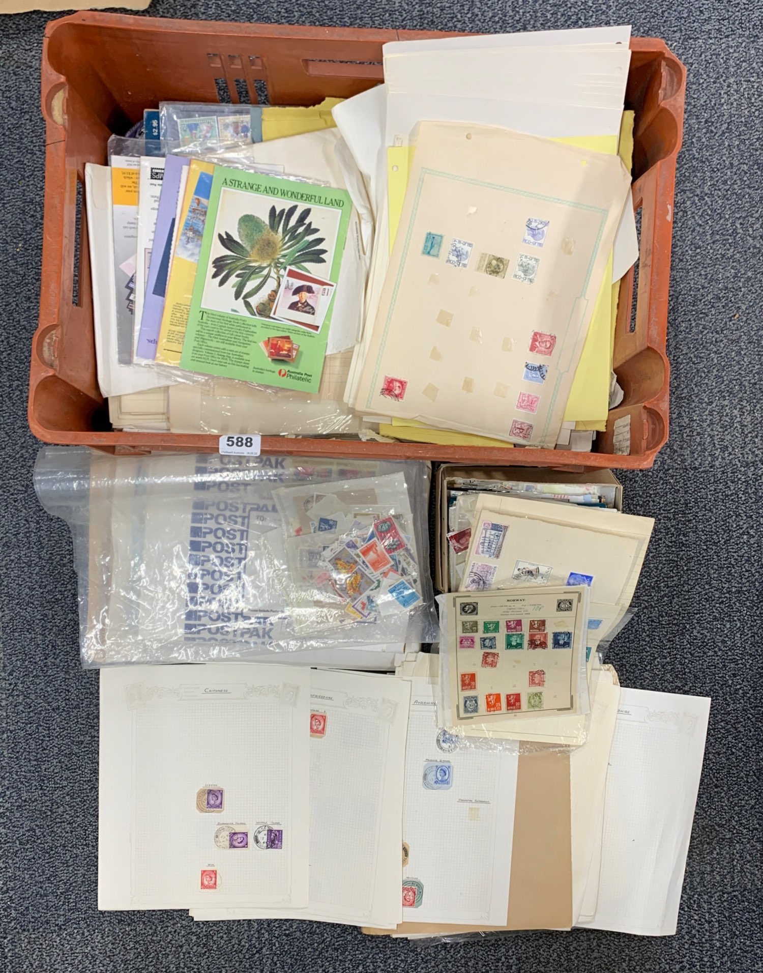 A large box of mixed stamps.