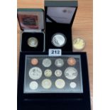 A group of 4 mixed boxed coins. HMS Dorsetshire silver 25 dollars, gun powder plot silver £2,