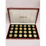 An impressive cased set of twenty four silver gilt special coronation commemorative ten dollar