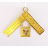 A 9ct gold Masonic set square engraved for 1938.