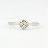 A 9ct white gold diamond set cluster ring, (M.5).