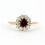 An 18ct yellow and white gold natural ruby and diamond set cluster ring, (O).