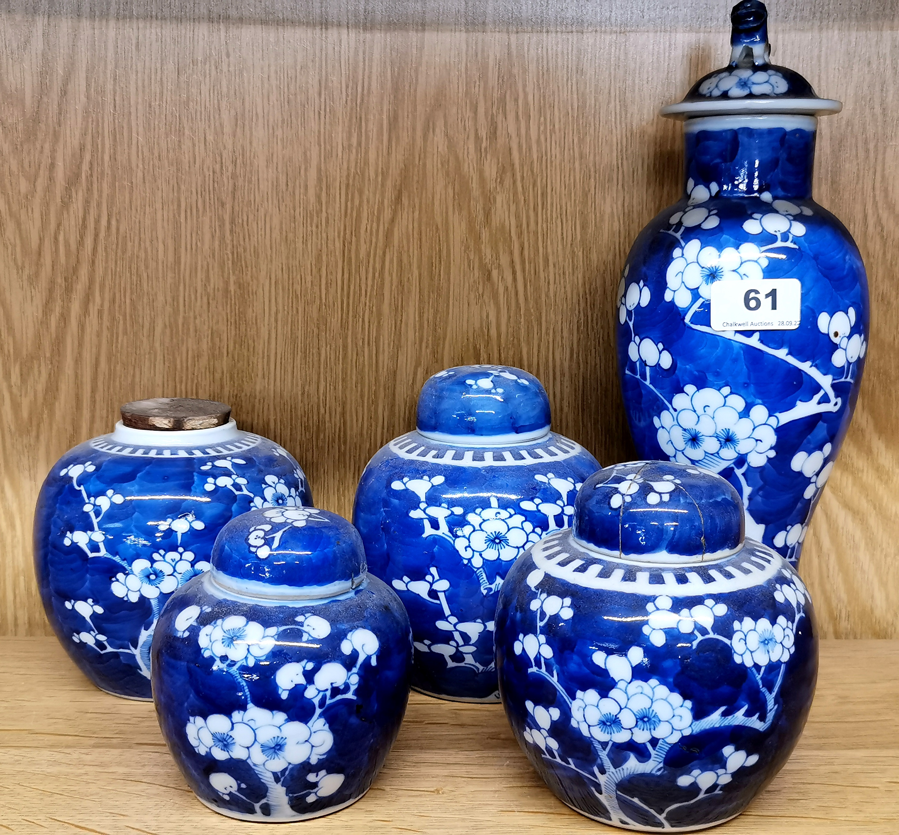 A Chinese prunus pattern porcelain vase and cover, H. 32cm, together with four ginger jars (two lids