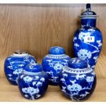 A Chinese prunus pattern porcelain vase and cover, H. 32cm, together with four ginger jars (two lids