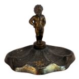 A WWII Belgian cast soft metal amusing figure of 'Mannekin pis' urinating on a Swastika, H. 30cm.