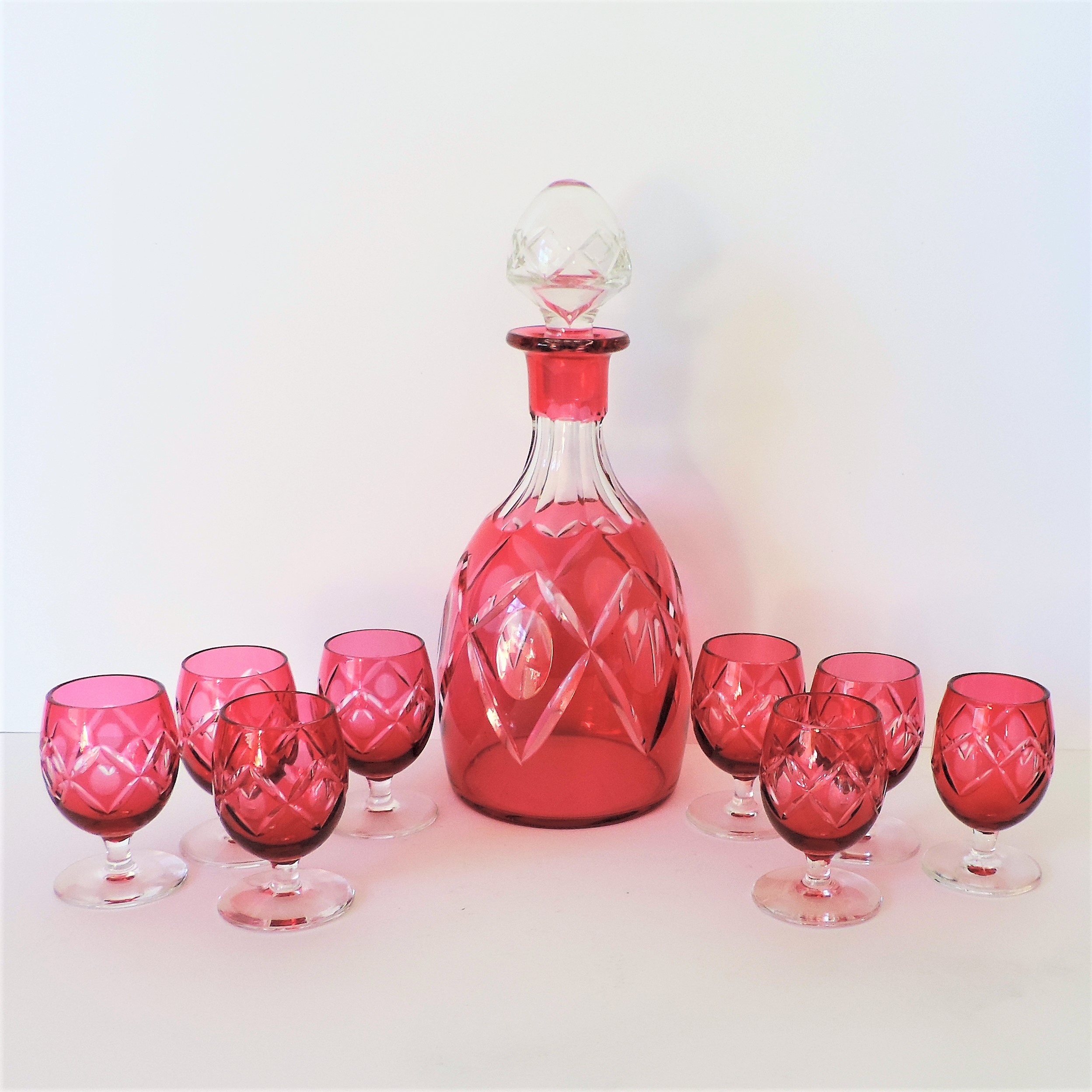 Vintage French Ruby Glass Decanter & Liqueur Glasses. A fine quality ruby glass decanter and 8