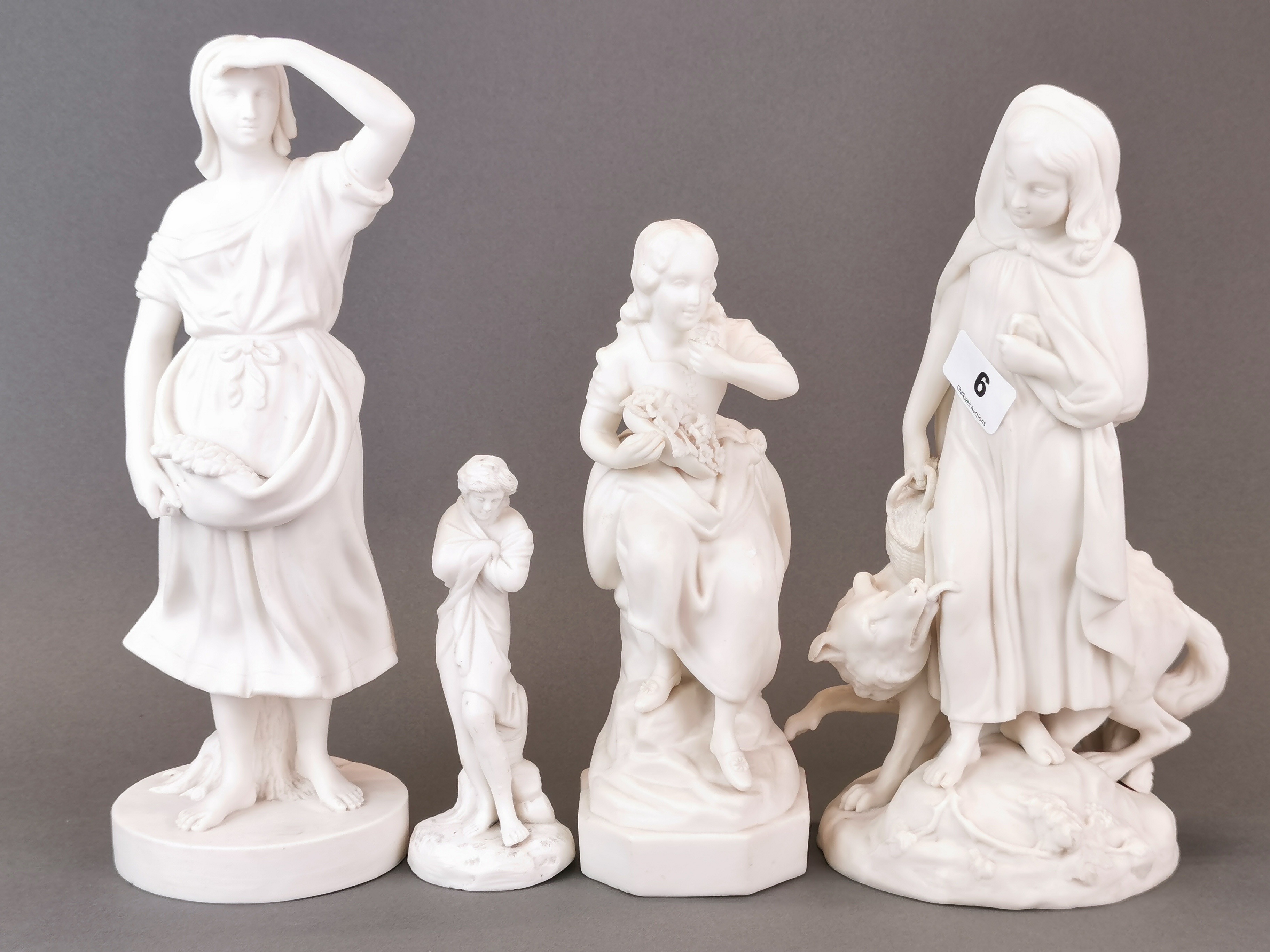 A 19th century Parianware figure of Red Riding Hood (with some restoration) together with three