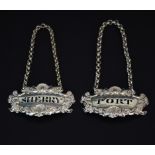 A pair of Victorian hallmarked (partially obscured) port and sherry labels, W. 6cm.