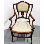 An inlaid Edwardian mahogany arm chair.