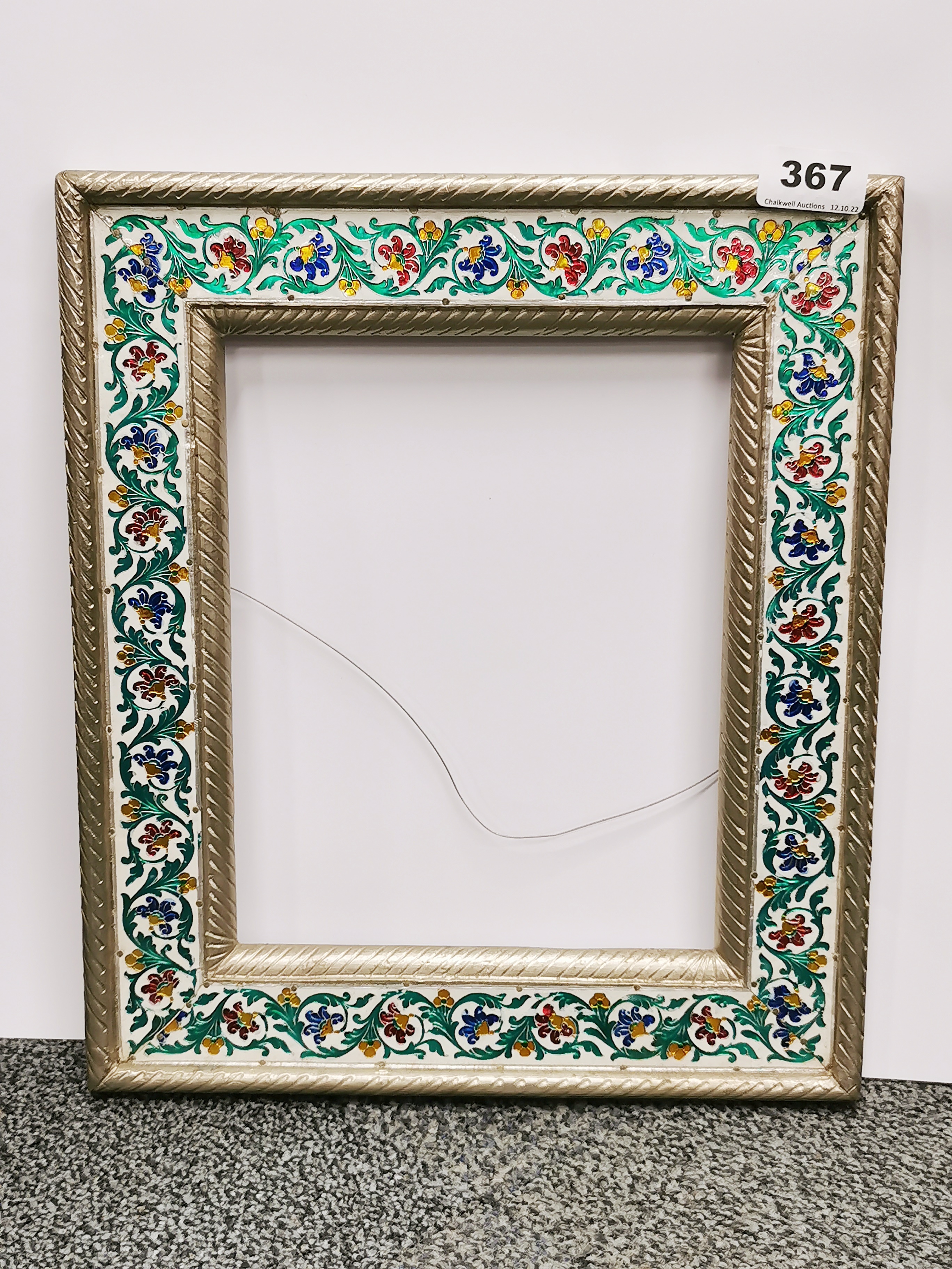 A Persian metal covered picture/mirror frame, 31 x 36cm.