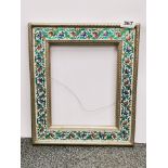 A Persian metal covered picture/mirror frame, 31 x 36cm.