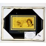 A framed gold plated £50 bank note with certificate.