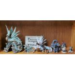 A collection of nine ceramic and other dragon figures, largest H. 28cm.