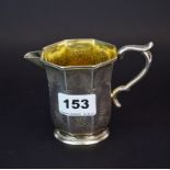 An American silver cream jug (tested) with gilt lining by John Warrin of New York, H. 9cm.