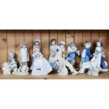A group of Nao and other porcelain figures.