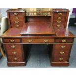 A 19th C mahogany desk with Wellington chest style upper drawers, 137 x 73 x 117cm.