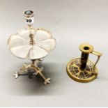 An Arts and Crafts silver plated candlestick together with an Arts and Crafts brass and rosewood