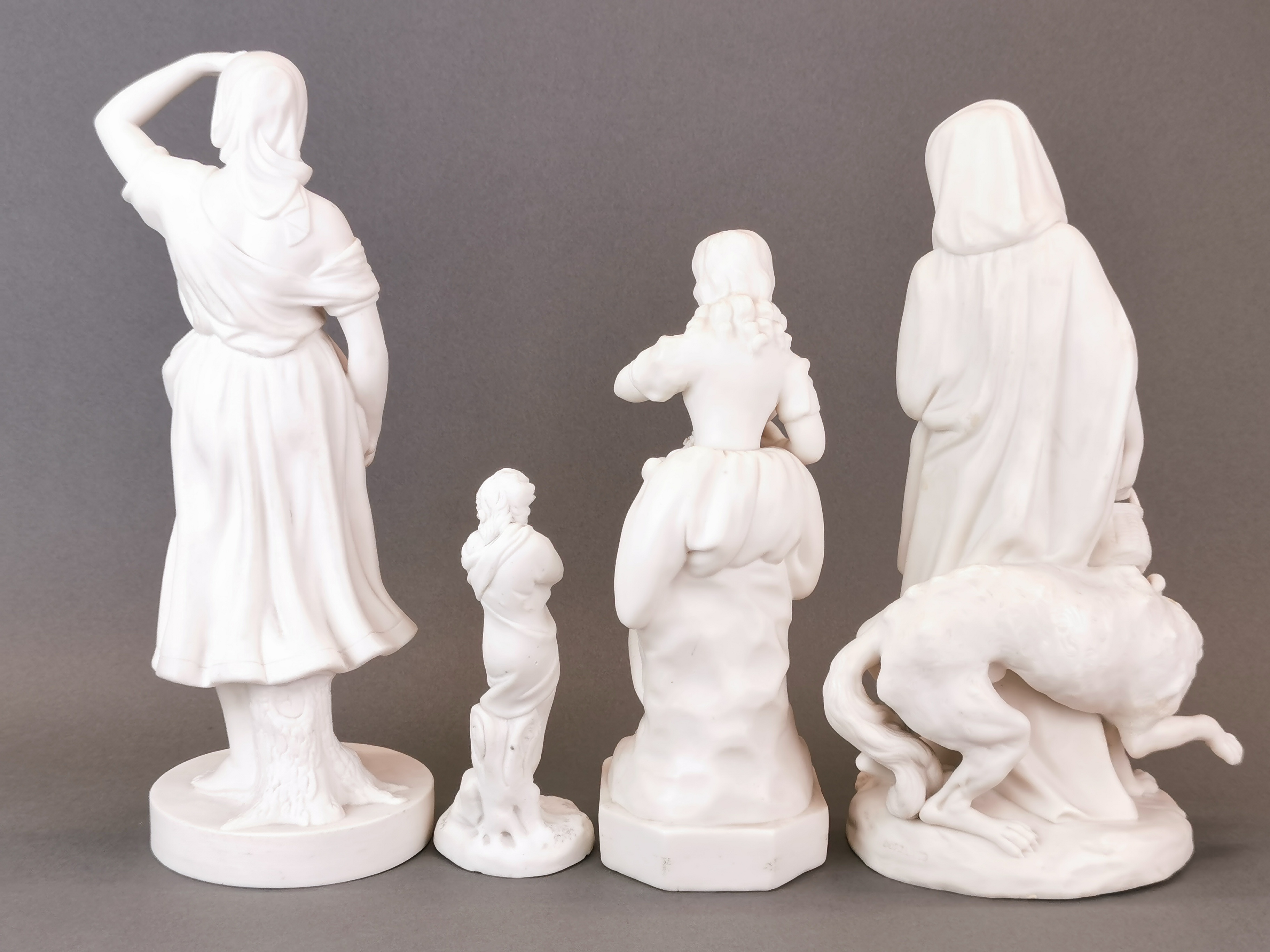 A 19th century Parianware figure of Red Riding Hood (with some restoration) together with three - Image 2 of 3