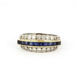 A yellow and white metal (tested high carat gold) ring set with square cut sapphires and graduated
