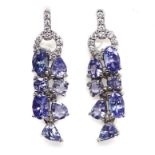 A pair of 925 silver drop earrings set with mixed cut tanzanites and white stones, L. 2.6cm.