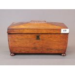 An early 19th century rosewood veneered tea box, W. 33cm. H. 18cm.
