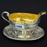 A superb early French hallmarked silver and gilt lined saucier, L. 19cm. H. 12cm.
