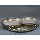 Three silver plated gallery trays, largest W. 62cm.