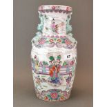 A Chinese hand enamelled porcelain vase with playful lion dog handles, H. 36cm.