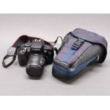 A Canon EOS700 camera with Canon zoom lens and case.