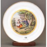 An early hand painted English porcelain plate decorated with children playing blind man's buff, Dia.