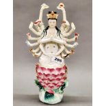 A Chinese hand painted porcelain figure of a multi-arm goddess, H. 34cm.