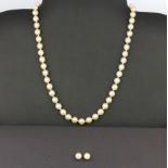 A cultured pearl necklace, L. 42cm, with a matching pair of pearl set stud earrings.