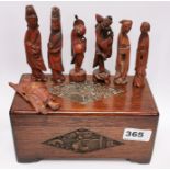 A Chinese carved oak box containing a group of seven Chinese carved wooden figures, box W. 20cm,