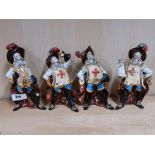 A group of four Italian hand painted porcelain figurines of Musketeers, H. 18cm.