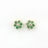 A pair of 9ct yellow gold emerald and diamond set cluster stud earrings, L. 0.6cm.