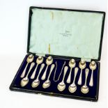 A cased set of 12 Walker & Hall hallmarked silver tea spoons and tongs c.1927.