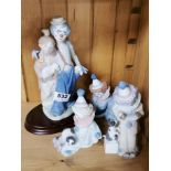 A group of Lladro clown figures. Some with boxes.