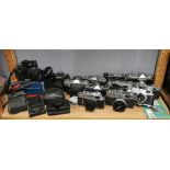 A group of mixed vintage cameras.