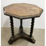 A 19th C carved oak octagonal table, 59 x 59 x 67cm.