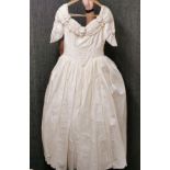A vintage cream silk wedding dress.