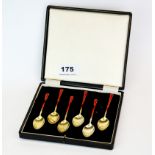 A lovely set of six hallmarked silver and enamel gilt bowl coffee spoons.