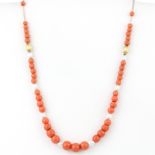 A 9ct yellow gold coral and pearl set necklace, L. 42cm.