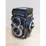 A Rolleiflex twin lens reflex camera.