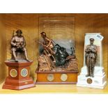 A group of three WWI memorial collectors items with coins, tallest H. 35cm.