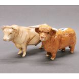 Two Beswick figures of bulls, L. 23cm.